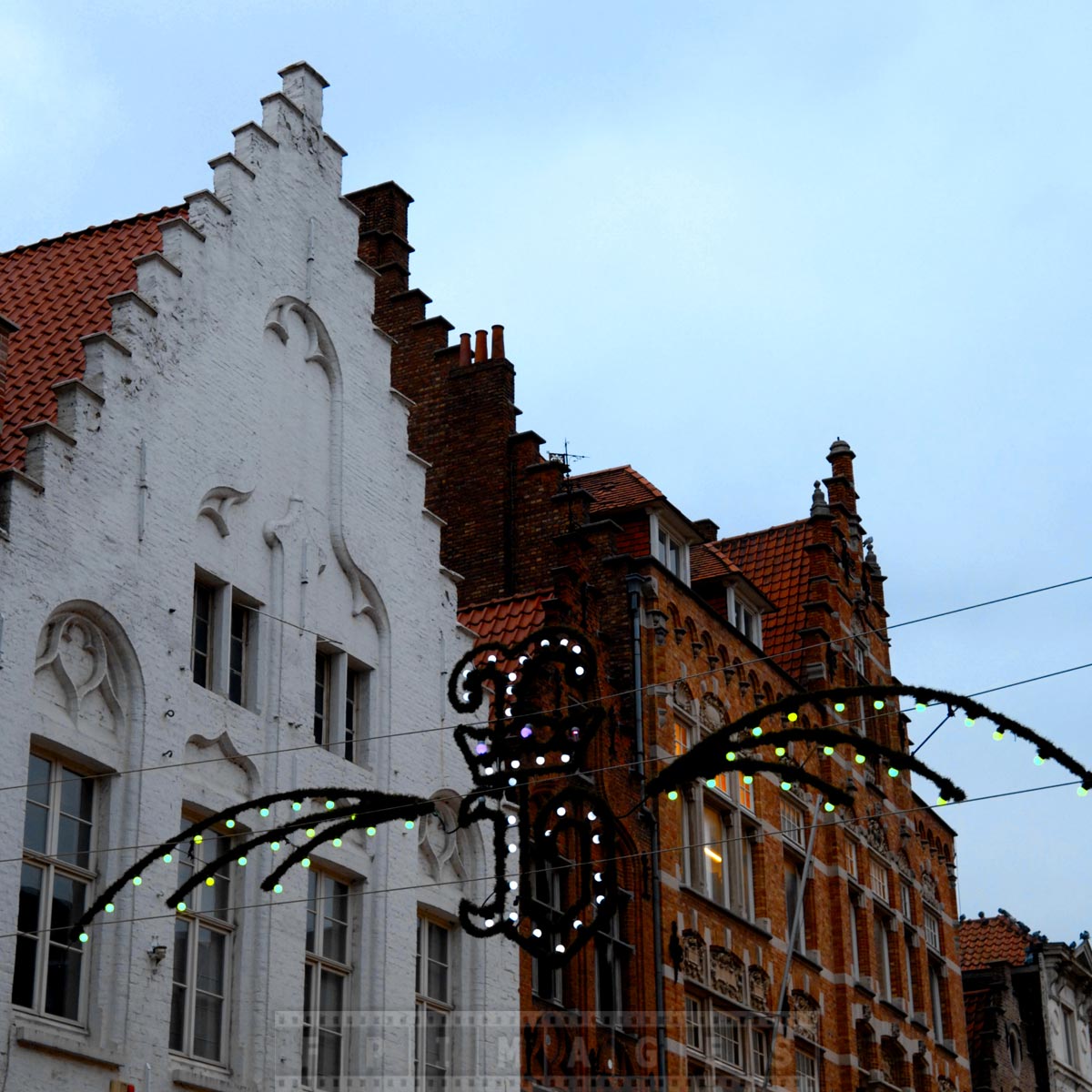 Letter B for Bruges and typical medieval roofs of old European town