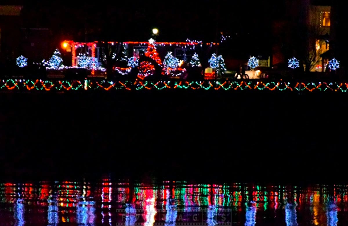 Bright and colorful Xmas lights and reflections in the harbour at night