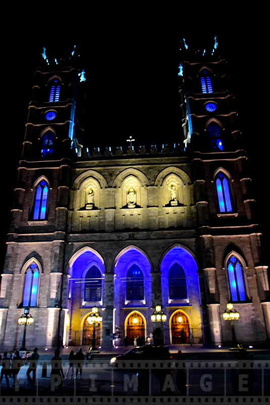 Facade of Basilica with blue light at night