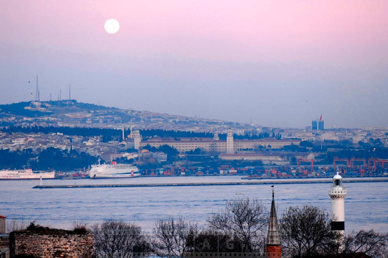 Full moon over Bosphorus and Istanbul lighthouse