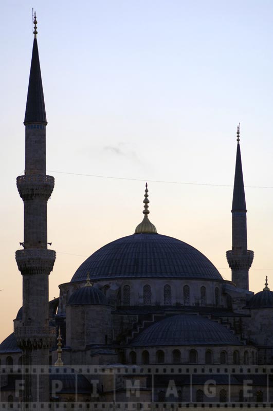 Silhouettes of the dome and minarets ta sunset