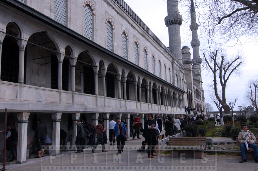 People getting for prayer at the mosque (ablution)