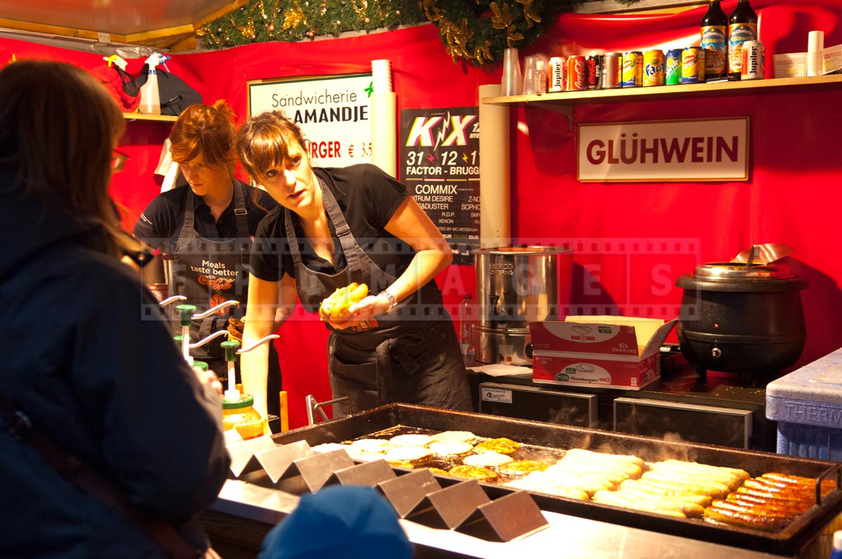 women making Belgian sausage sandwiches