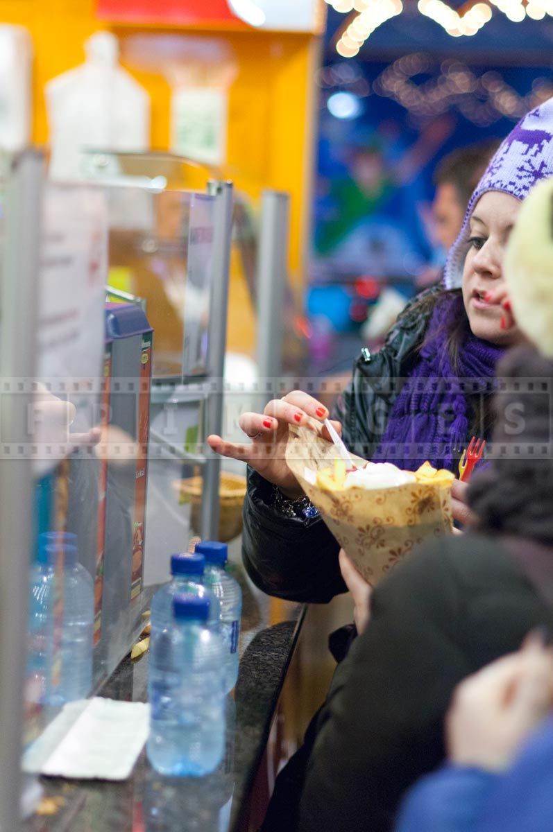 people eating Belgian fries