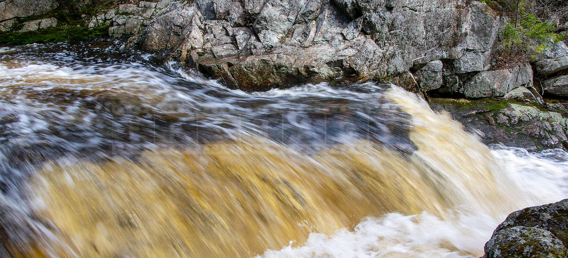 fast moving water at Millet Falls waterfall