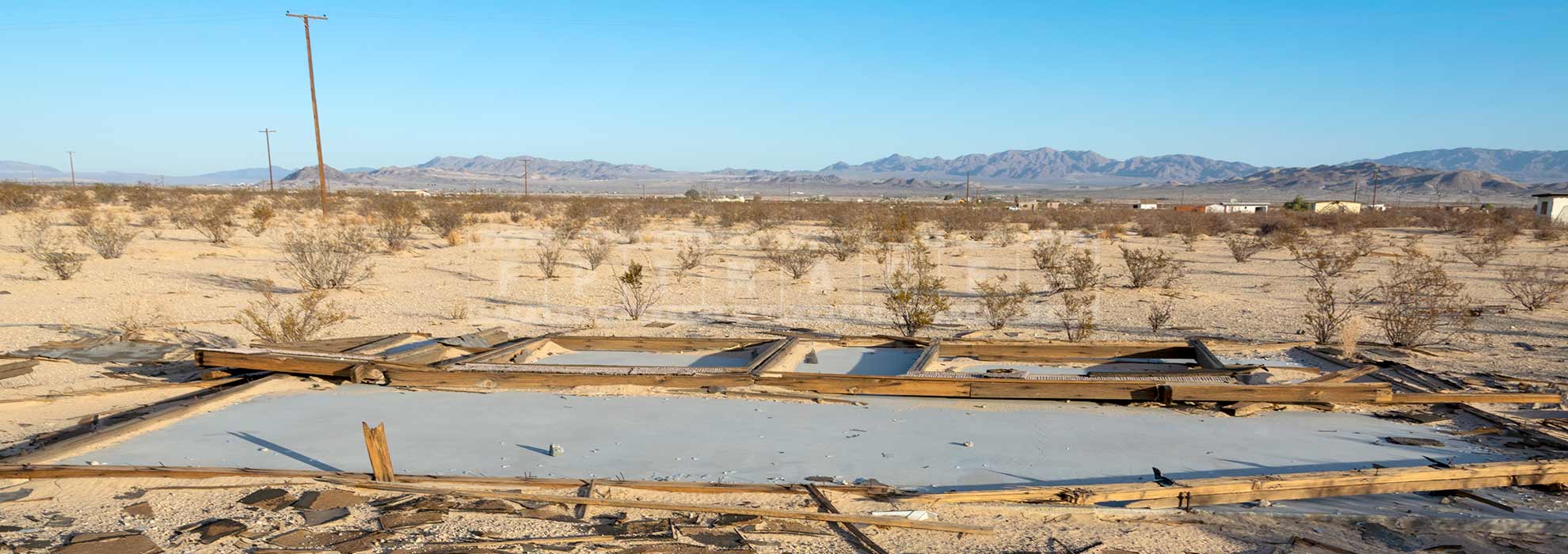 old foundation of the house decaying in the desert