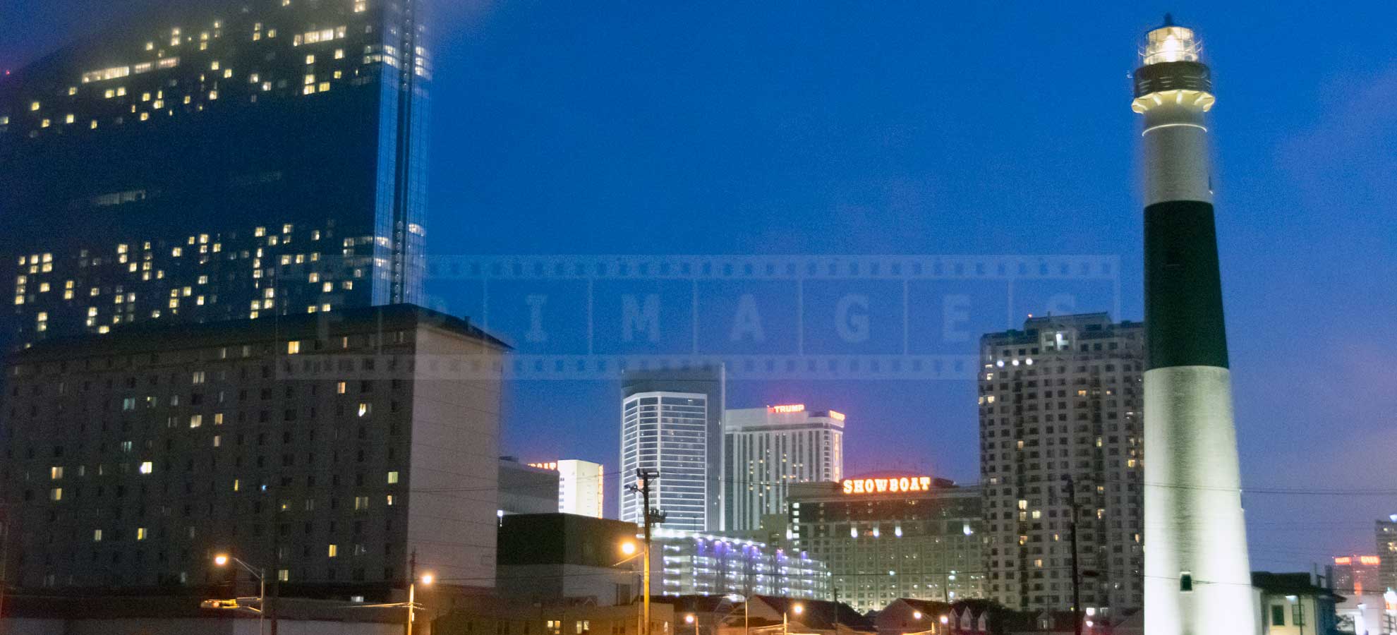 Night view of the Absecon lighthouse and casinos in Atlantic City