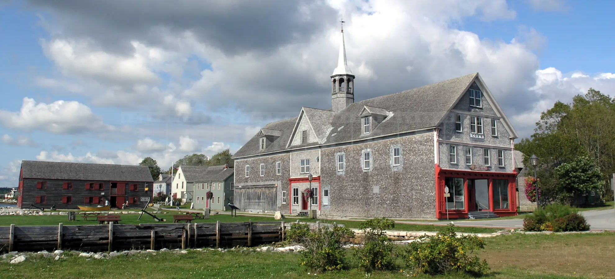 Old wooden buildings on waterfront in Shelburne, NS, Canada